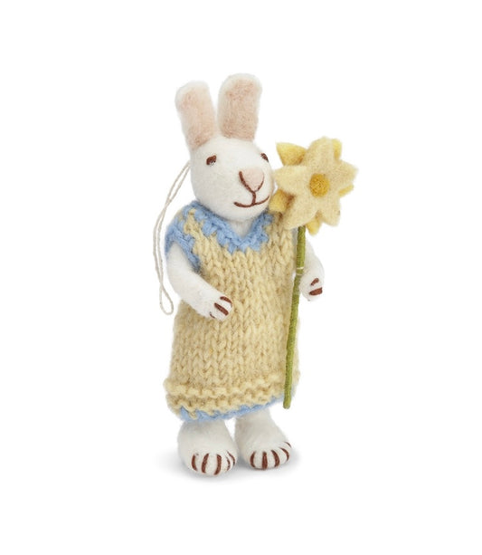 Weißer Hase mit gelben Kleid und Blume